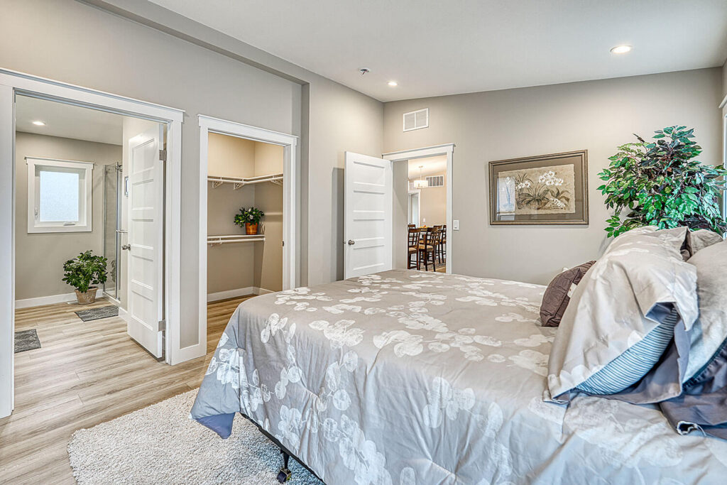 Master with ensuite and walk-in closet visible through doorways