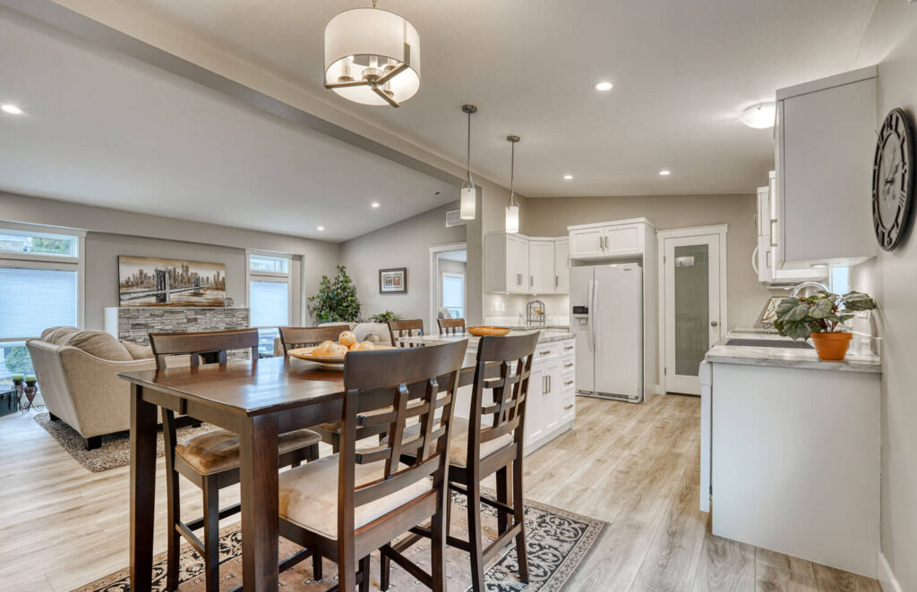 Open concept dining and kitchen with vaulted ceiling