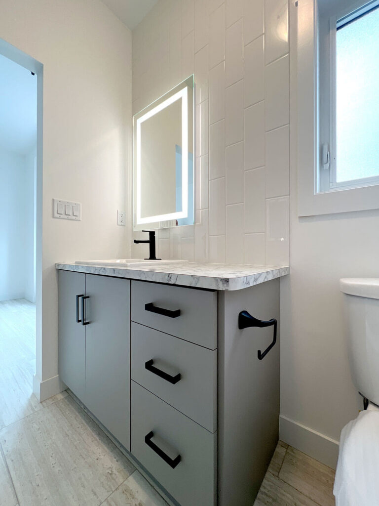 Eclipse vanity with LED backlit mirror