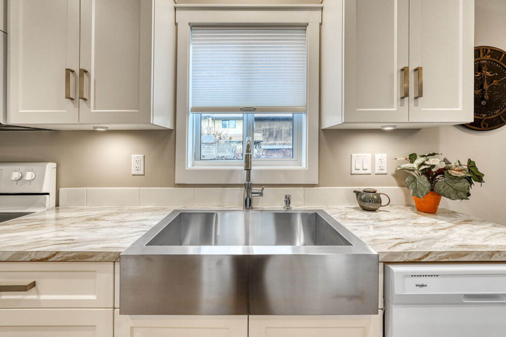 Kitchen with stylish fixtures and warm tones